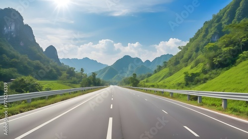 Beautiful highway road with green mountain and blue sky background.
