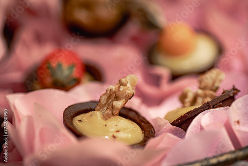 wedding party sweets placed in molds in iron containers on a wooden table
