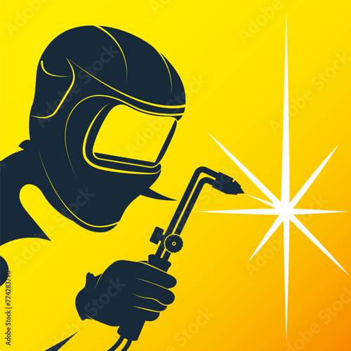 Welder in a mask and a welding machine in his hand