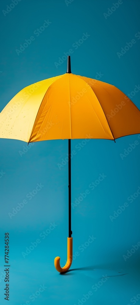 A yellow umbrella is on a blue background