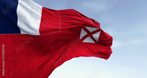 National flag of Wallis and Futuna waving on a clear day. photo