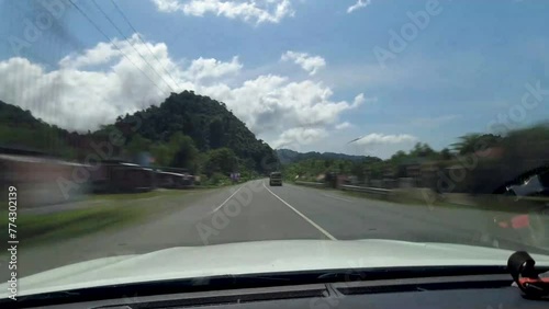 POV car driving in Aceh Besar, Indonesia. The hyperlapse of car driving on Aceh province road.  photo