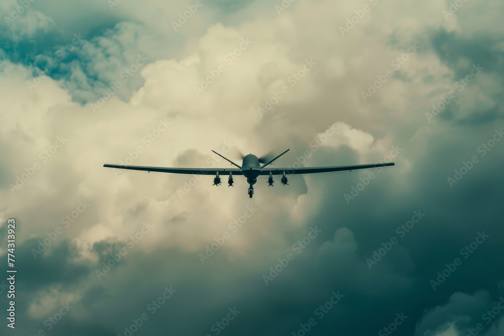 A military drone flies through a cloudy sky