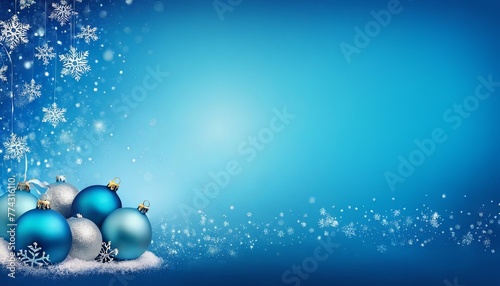 Christmas background with a blue color, decorated with snowflakes and Christmas balls, with a Copy space