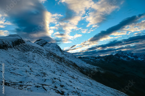 Panoramic sunrise view of snow capped alpine terrain in High Tauern National Park, Carinthia, Austria. Looking at majestic Hochalmspitze seen from Hannoverhaus. Wanderlust Austrian Alps. Nature escape