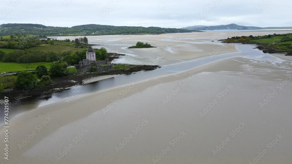 A wide shot of the sandy bay, showing an old Irish castle along the Atlantic coast. Doe Castle, Co. Donegal, Ireland A wide shot of the sandy bay, showing an old Irish castle along the Atlantic coast. Doe Castle, Co. Donegal, Ireland