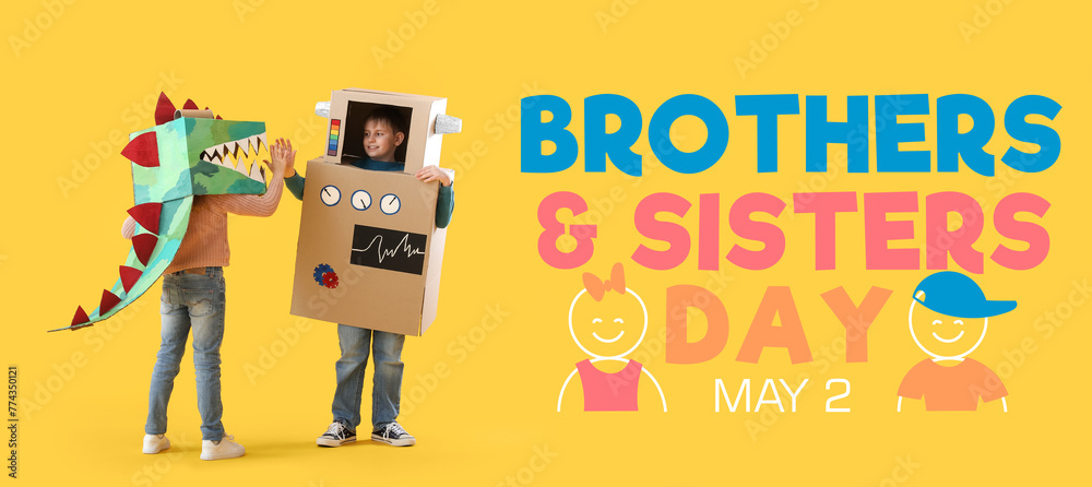 Little children in cardboard costumes giving each other high-five on yellow background - obrazy, fototapety, plakaty 