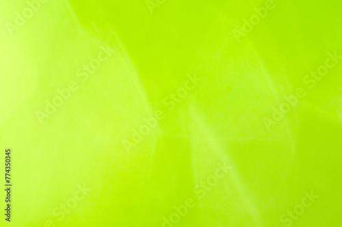 Abstract bright light green blurred background, spring background with sun glare