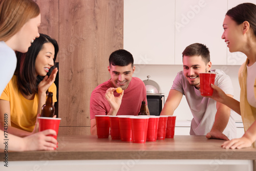 Group of young friends play...
