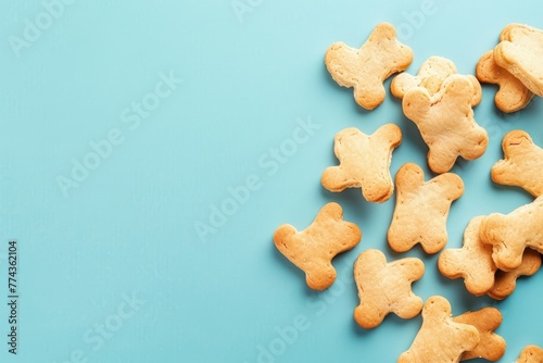 Bone shaped dog treats on colorful background for pet food advertising