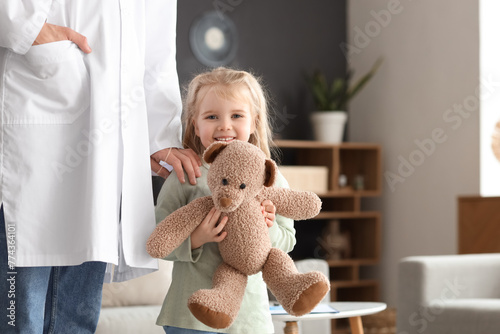 Smiling little girl holding...