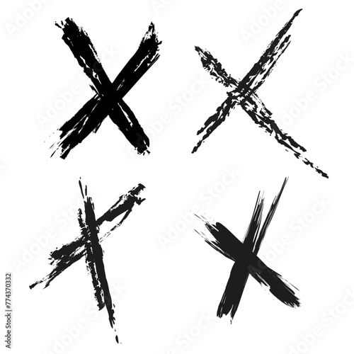 Crossed out X mark drawn with black dry charcoal strokes in letter x shape in vector - jagged scratched lines isolated on white paper background with excess pencil shards around photo