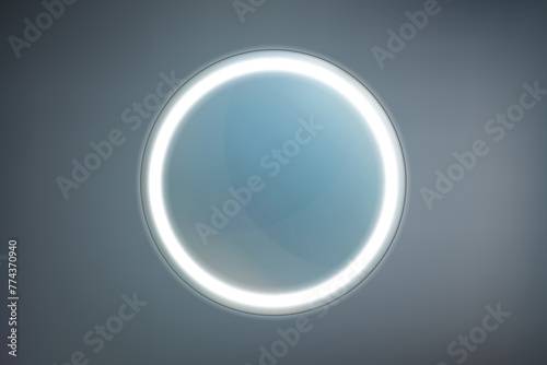 Round bathroom or vanity mirror with white LED backlit on a dark background photo