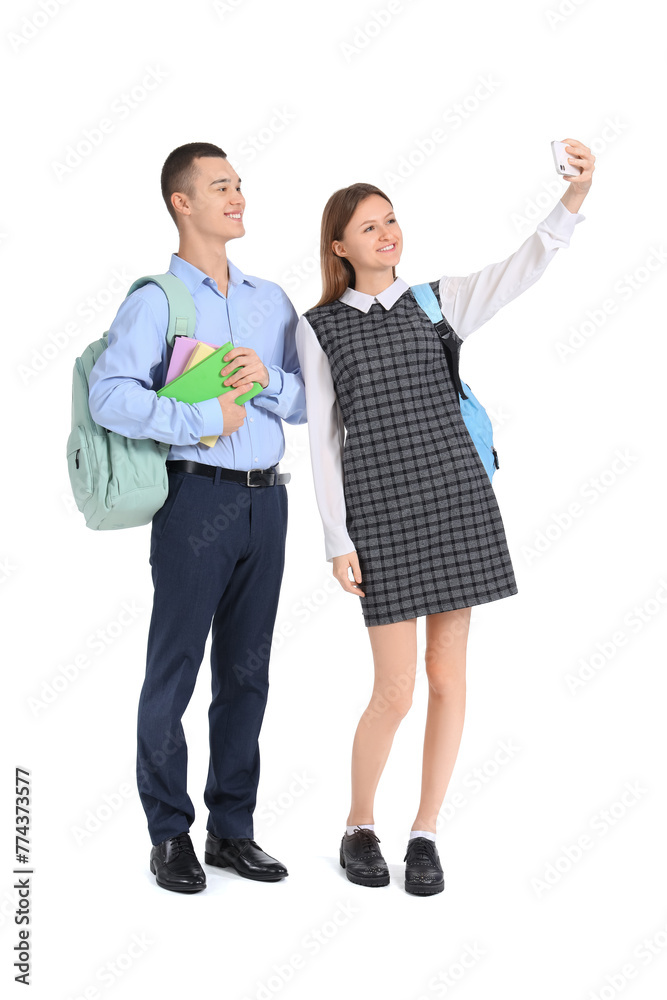 Students with books taking selfie on white background. End of school concept Students with books taking selfie on white background. End of school concept