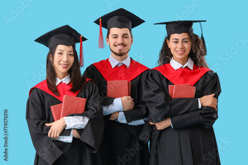 Graduate students with book...
