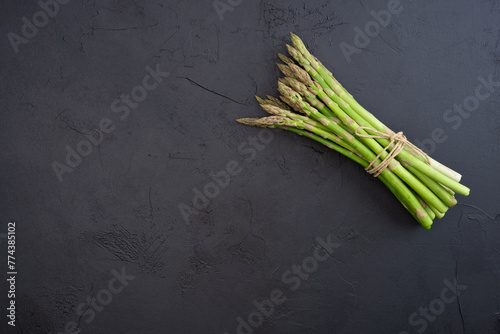 Fresh green asparagus on the black  background