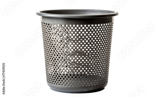 A metal trash can with intricate holes, creating a whimsical pattern when sunlight shines through
