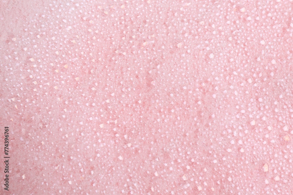 White fluffy foam on pink background, top view White fluffy foam on pink background, top view
