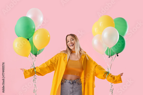 Young woman in raincoat wit...