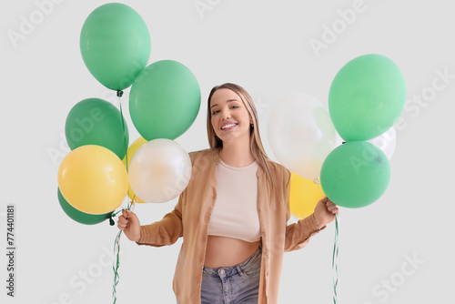 Young woman with balloons o...