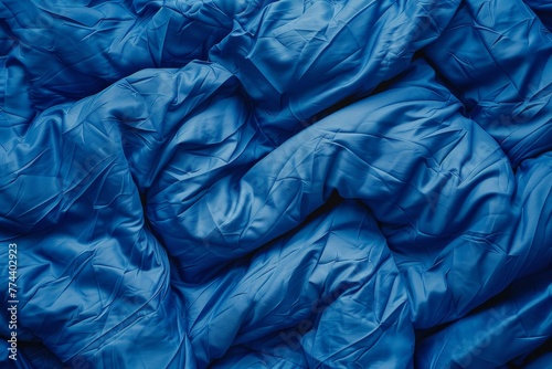 Blue fabric of sleeping bag © VolumeThings