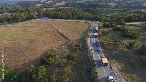 Vehicles in a row on a country road