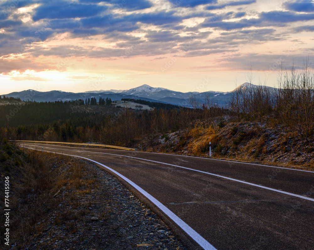 Asphalt road curve and autumn sunset Mountains, Ukraine, Carpathian.