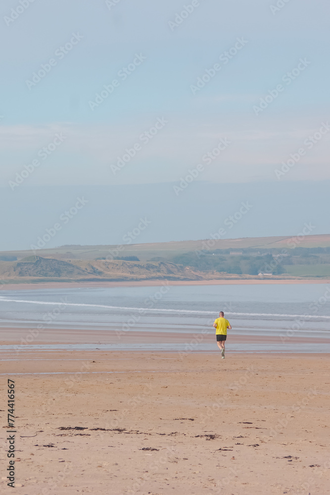 person running on beach