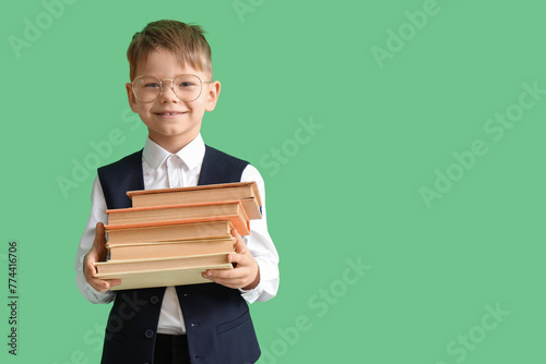 Cute little schoolboy in ey...