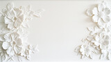 Relief flower decoration in plaster on a white wall. Space for copy