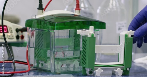 Presentation of a device for vertical electrophoresis of nucleic acid and protein molecules, a block for attaching glasses with agarose gel. photo