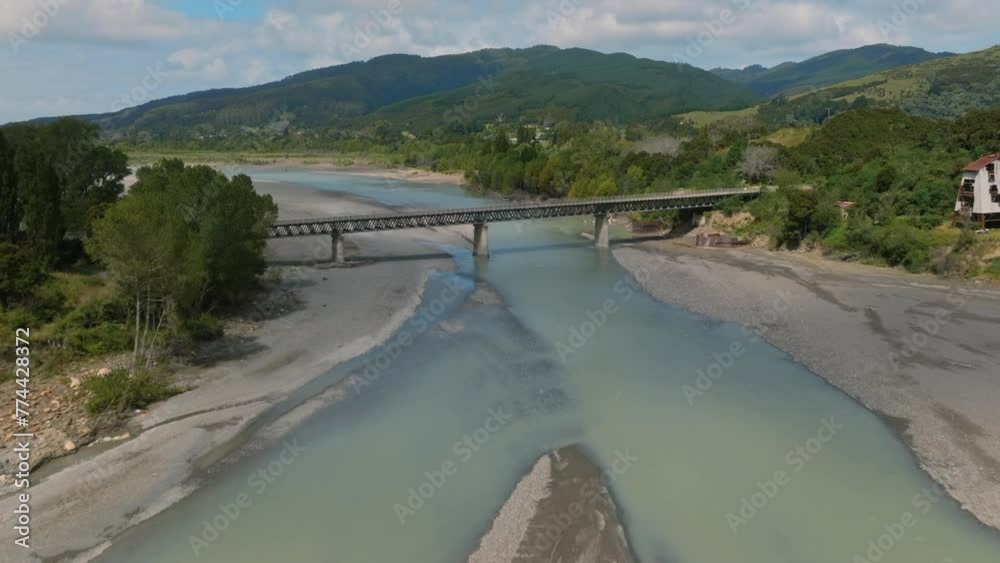 Aerial: Bridge crossing the Waiapu River, Ruatoria, Gisborne, New Zealand.