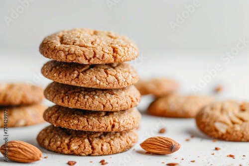 Pile of almond cookies on a white surface