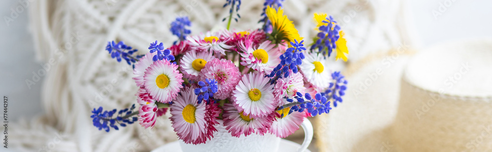 Banner. Flower arrangement with daisy and other summer flowers in a white cup. Spring floral composition. Greeting postcard for Mother's or Women's day, birthday, anniversary. Cozy atmosphere Banner. Flower arrangement with daisy and other summer flowers in a white cup. Spring floral composition. Greeting postcard for Mother's or Women's day, birthday, anniversary. Cozy atmosphere