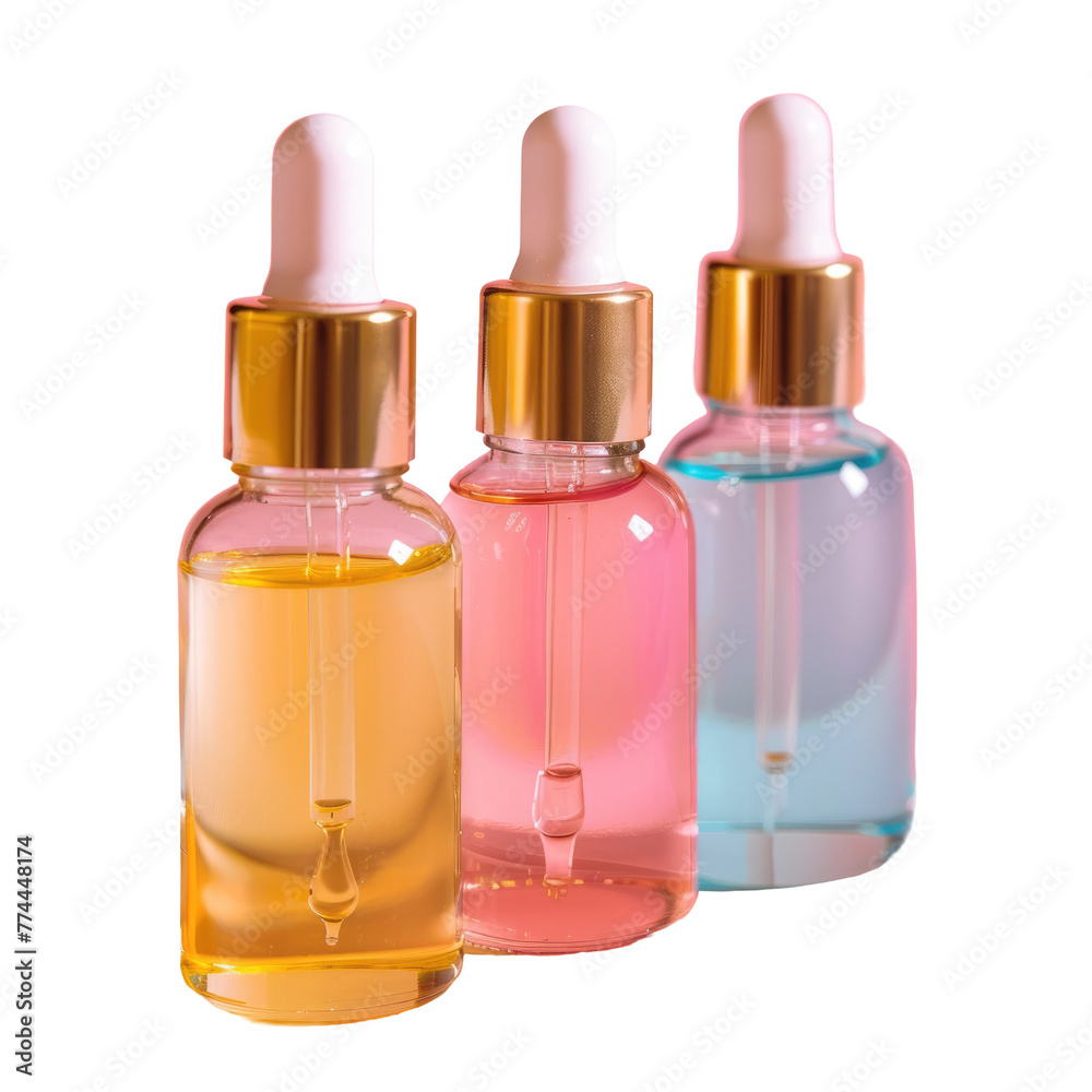 Three bottles of different colors of liquid with gold caps