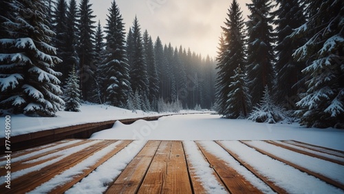 Winter christmas scenic landscape with copy space. Wooden flooring strewn with snow in forest with fir-trees covered with snow on nature. 