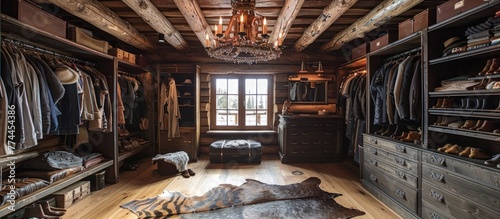 Rustic Dressing Room in a Cozy Log Cabin with Exposed Beams and Animal Hide Rugs