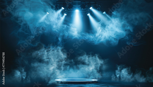 The dark stage with smoky dark blue background. an empty dark room with window shadows for display products. Concert stage with blue spotlight.