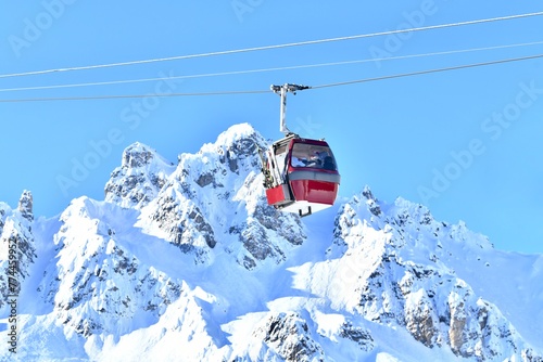 Vintage ski lift over the ski slopes of French alps.