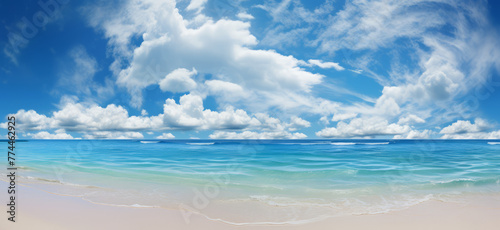 A panoramic view of the clear blue sky with white sandy beaches stretching into the distance under bright sunshine