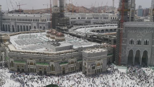 Bird's eye view of Muslim pilgrims exit Masjid Al Haram Mosque via King Abdul Aziz gate in Makkah, Saudi Arabia. Haram Mosque is the holiest mosque in Islam photo