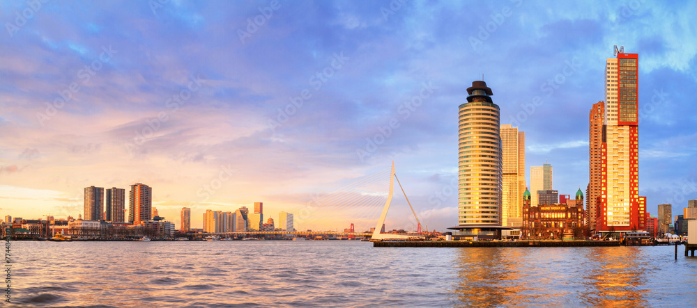Cityscape, panorama, banner - view of Rotterdam with Tower blocks in the Kop van Zuid neighbourhood and Erasmus Bridge, The Netherlands