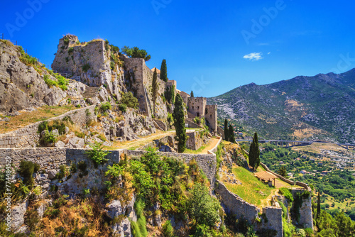 Summer landscape - view of the ruins of the Klis Fortress, near Split on the Adriatic coast of Croatia