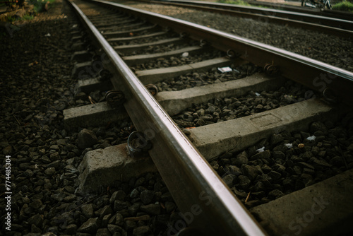 The train road in Bogor is made of iron on gravel