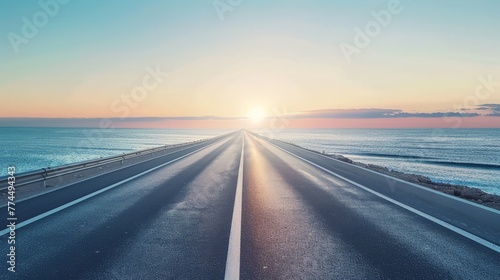 empty asphalt highway and blue sea nature landscape at sunset