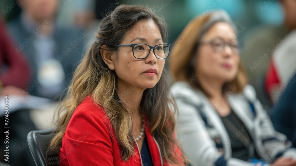Fototapeta premium Focused Professional Woman Attending a Business Conference Indoors During the Day