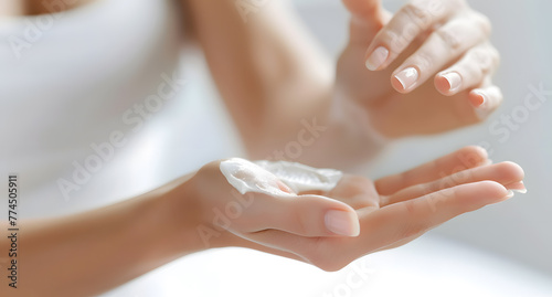 Healthcare concept. Closeup shot of young woman hands applying moisturizing hand cream.