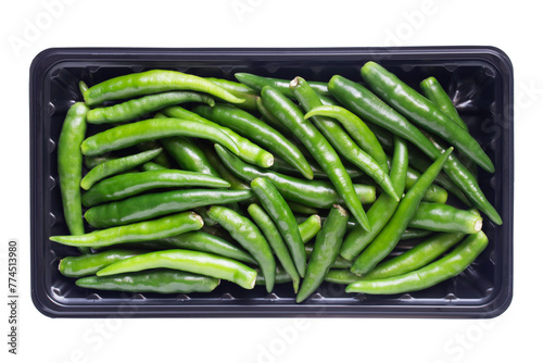 Top view of Green Chili or  Bird's Eye Chilli in Black Tray Isolated on White Background