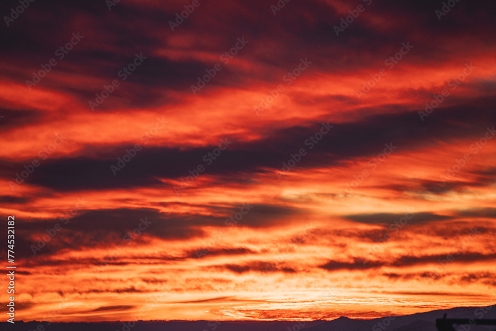 red sunset sky with clouds
