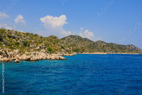 View of the rocky shore from the sea. Mediterranean Sea in Turkey. Popular tourist places. Background